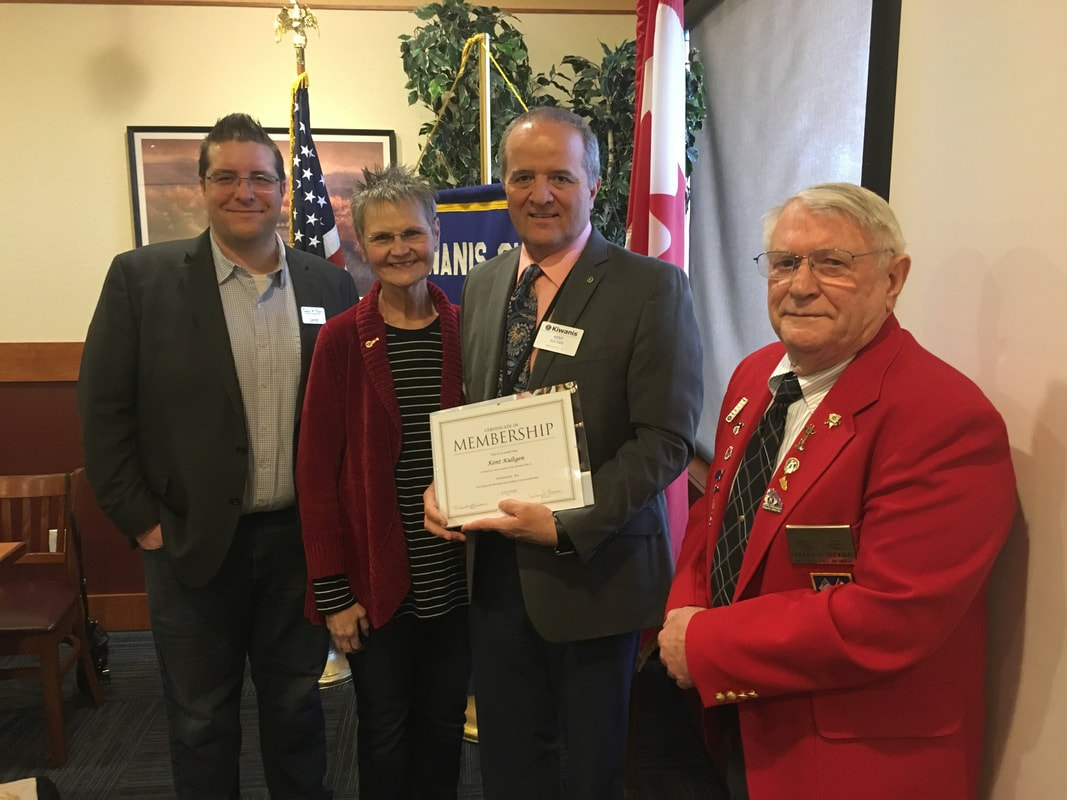 Dr. Kent Kultgen is introduced as a member of the Kiwanis Club of Snohomish by President Melody Dana and Board members Rod Vroman and Jared Burns